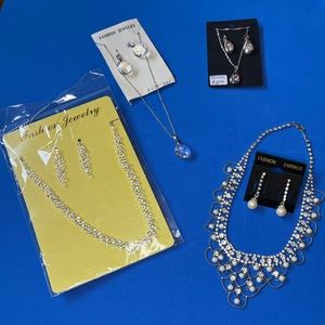 Lot of 4 necklace and earring costume jewelry sets. Lot number 66.